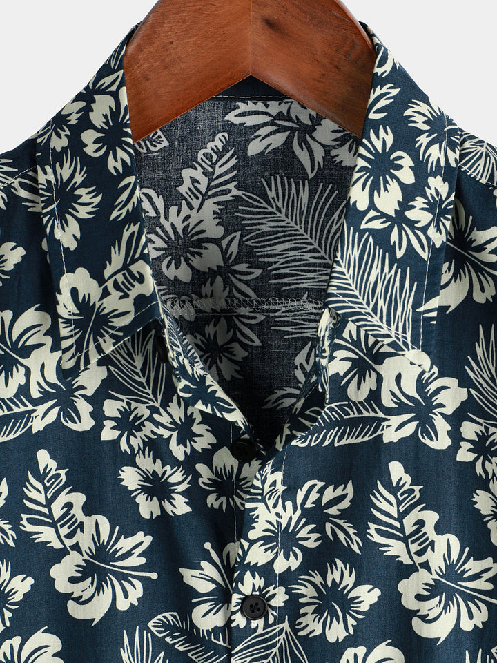 Chemise de plage boutonnée à manches courtes en coton avec feuilles de plantes tropicales bleues pour hommes Aloha Resort
