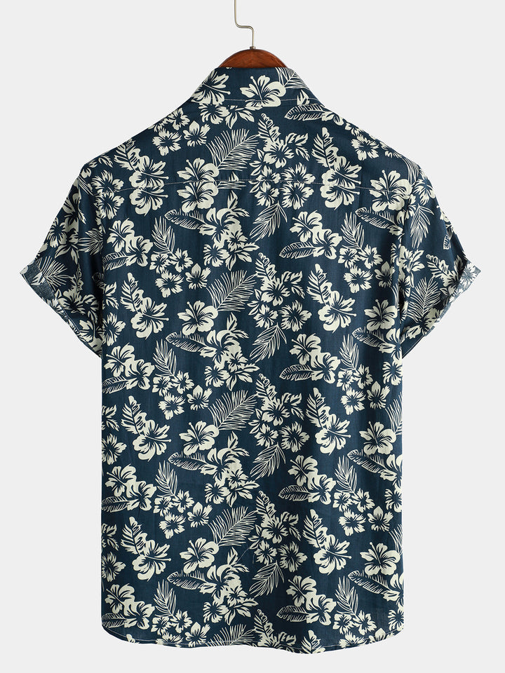Chemise de plage boutonnée à manches courtes en coton avec feuilles de plantes tropicales bleues pour hommes Aloha Resort