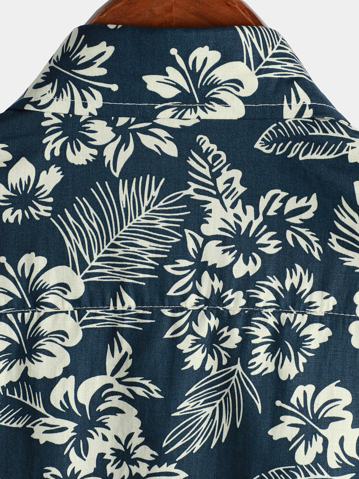 Chemise de plage boutonnée à manches courtes en coton avec feuilles de plantes tropicales bleues pour hommes Aloha Resort