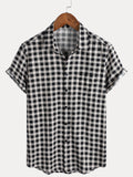 Chemise à manches courtes et poches en coton à carreaux noirs pour homme