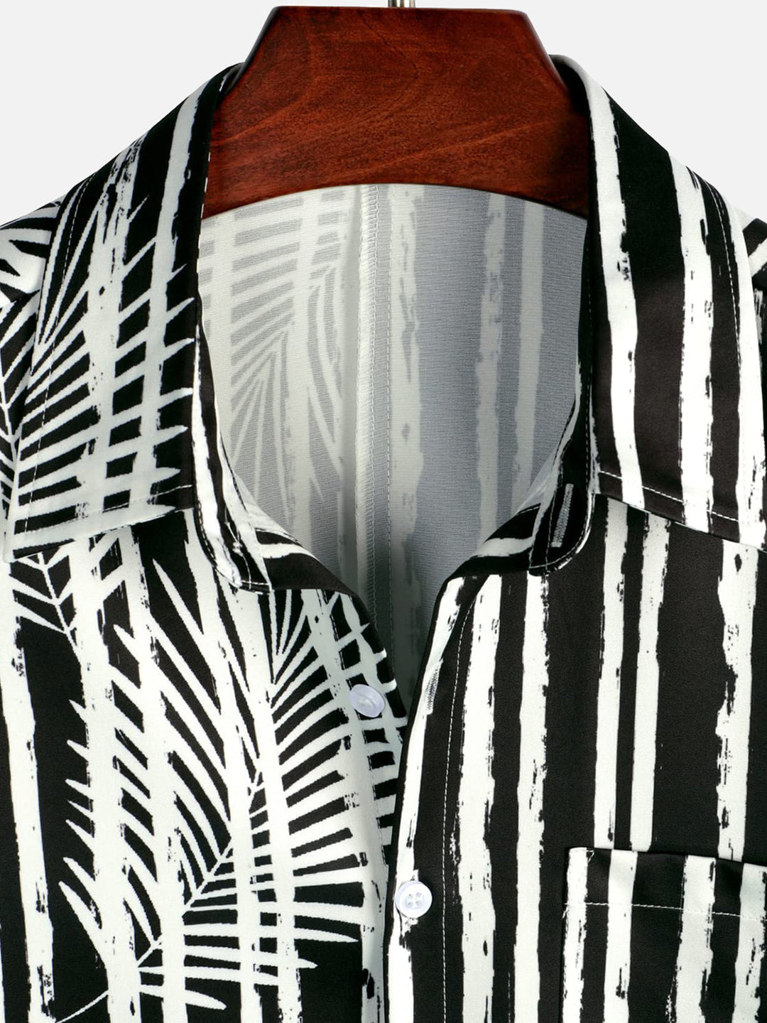 Chemise hawaïenne noire à manches courtes avec poche imprimée de plantes tropicales pour hommes