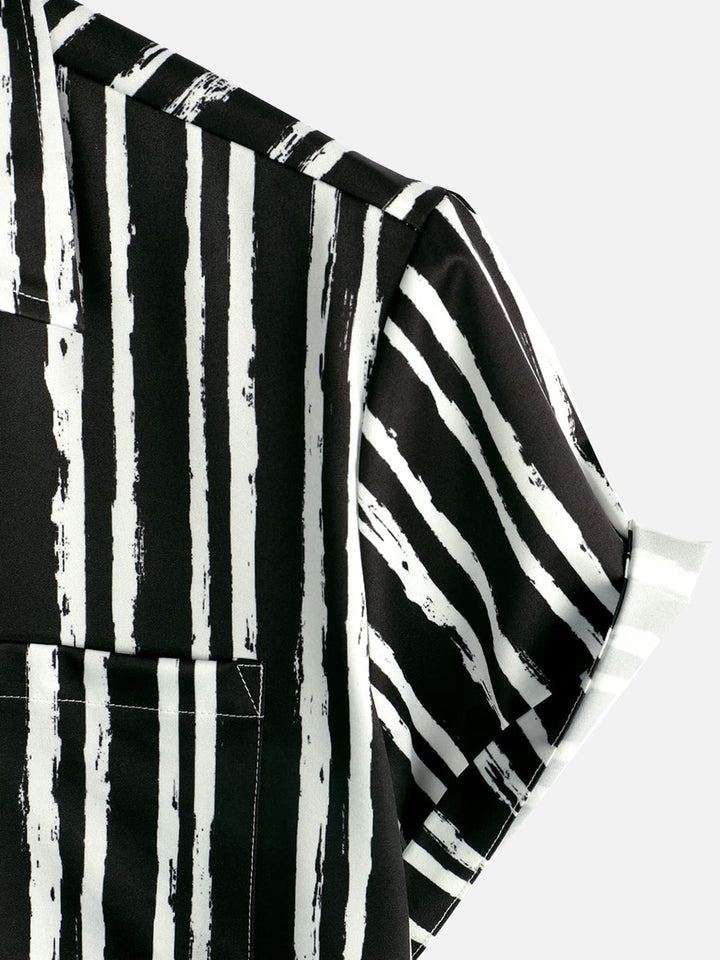 Chemise hawaïenne noire à manches courtes avec poche imprimée de plantes tropicales pour hommes