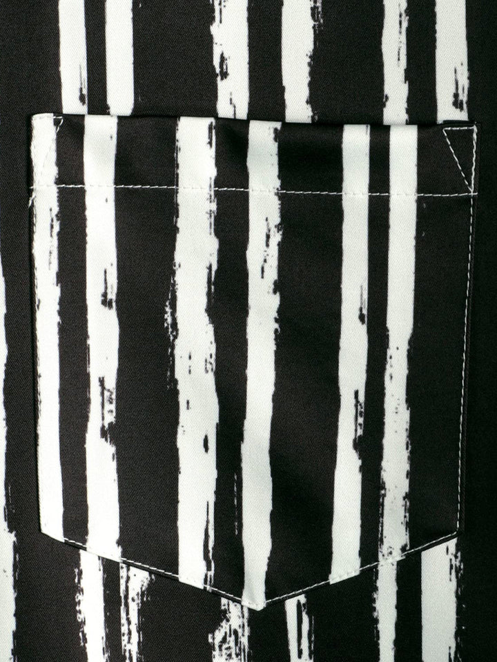 Chemise hawaïenne noire à manches courtes avec poche imprimée de plantes tropicales pour hommes